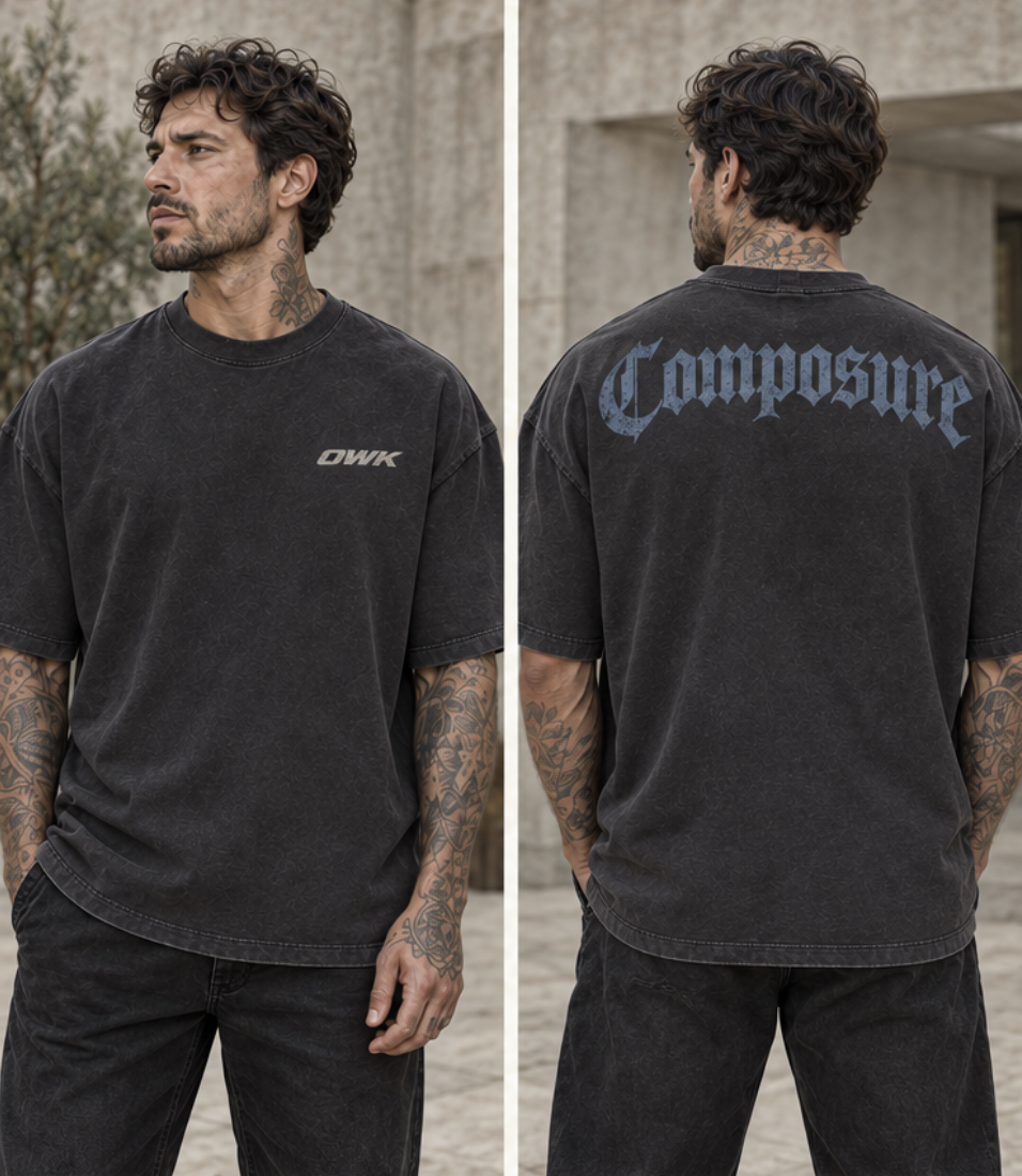 Minimal Composure shoulder wordmark on a charcoal tee
